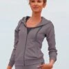 LASCANA ACTIVE Trainingsjacke, Mit Kapuze, Mit Logo Tape An Den Ärmeln -Bikini Mode Geschaft af32f4be1d8f341fea5ad8f3362122cb